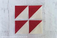 four red and cream half square triangles