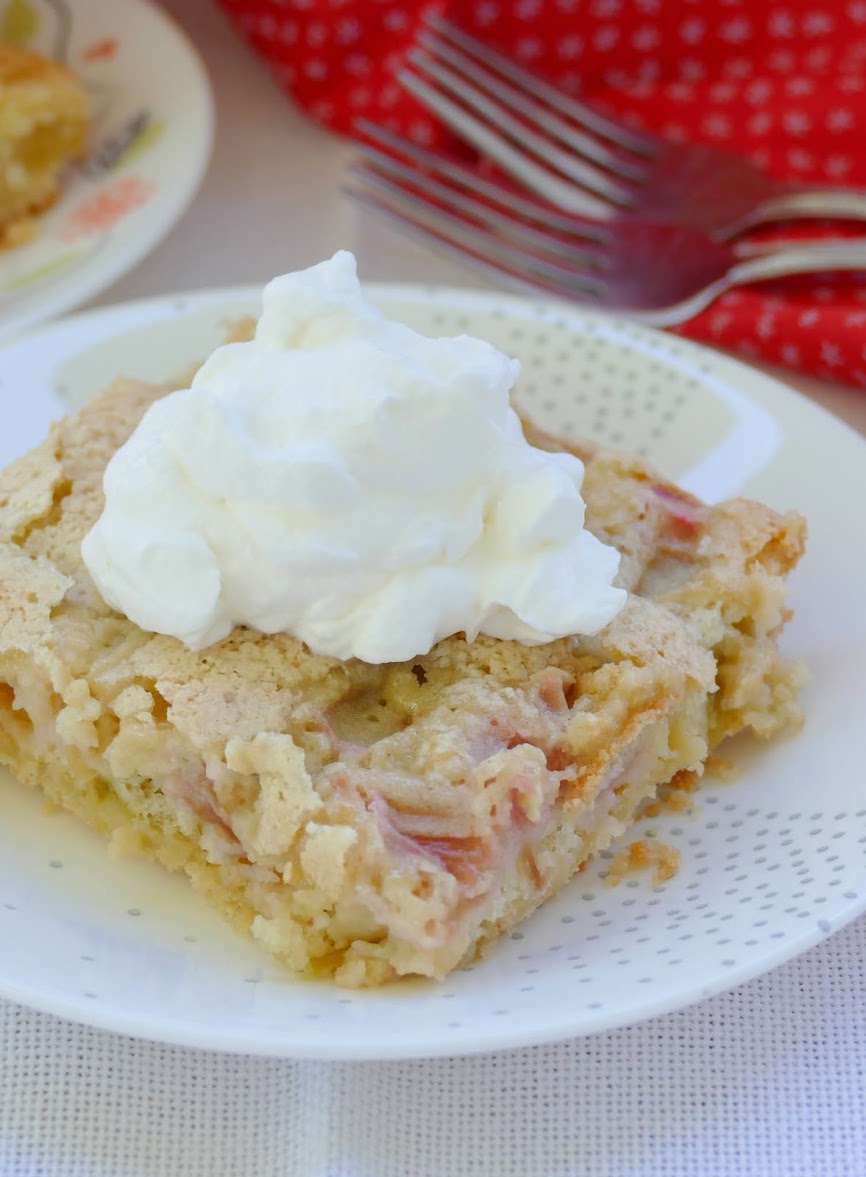 These amazing spring or summer rhubarb bars are a great potluck or party dessert! The buttery shortbread and tart rhubarb are a perfect pair and you'll find yourself wanting more than just one! Top them with whipped cream, sprinkled powdered sugar or ice cream for a wonderful, sweet treat!