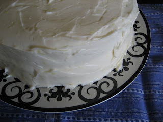white cake with lemon filling and lemon cream cheese frosting