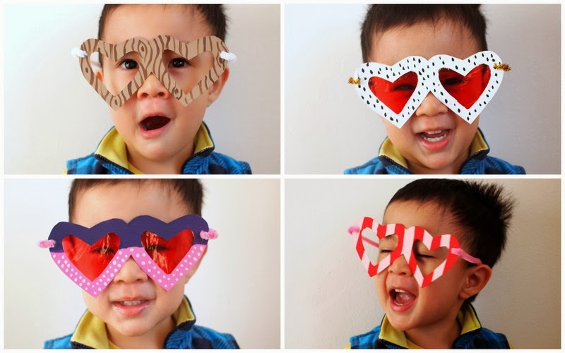 child wearing heart shaped glasses