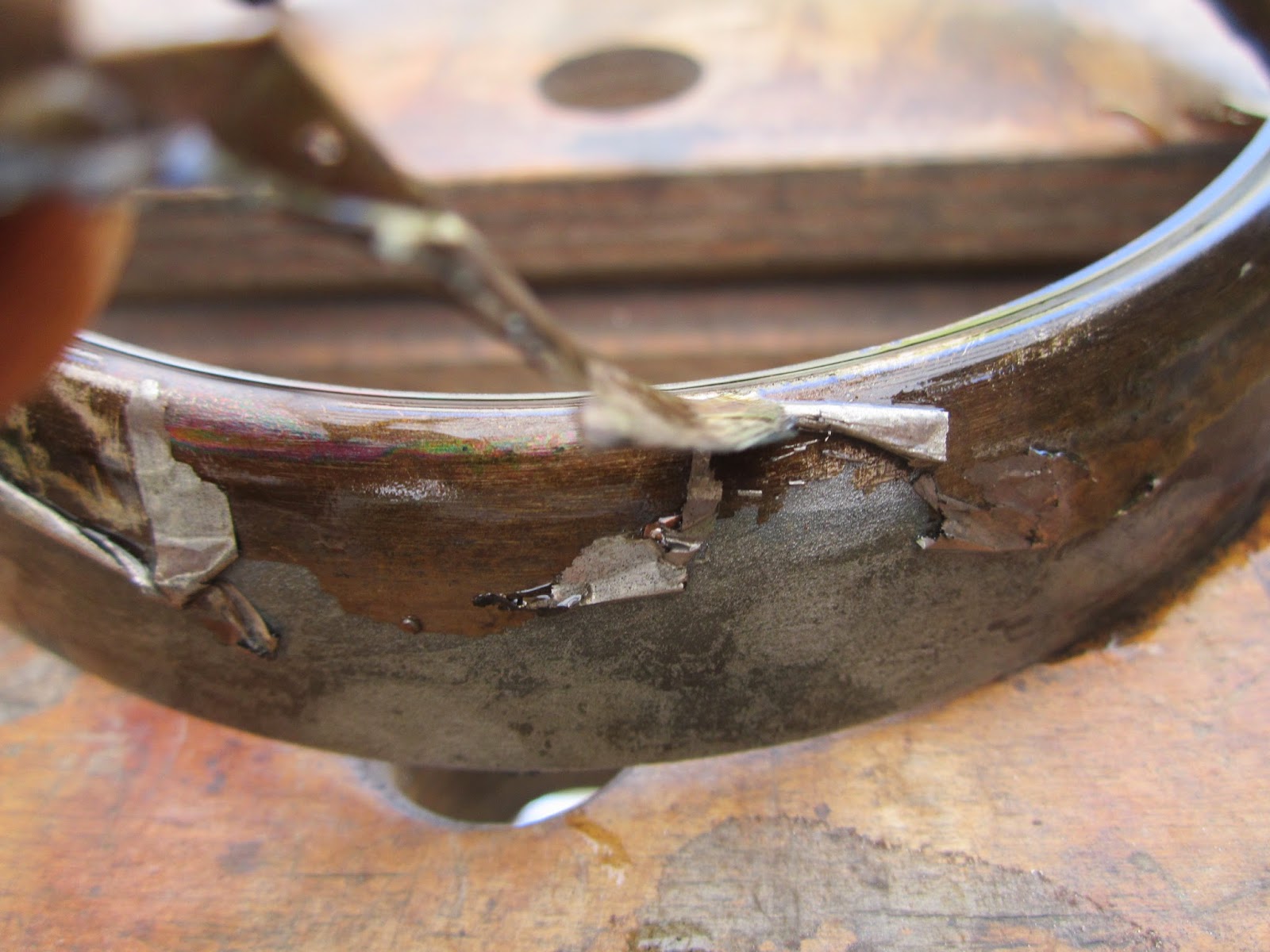 removing old nickel plating from headlight bezel with lead cathode