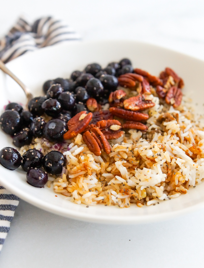 blueberry and salted pecan breakfast grain bowl