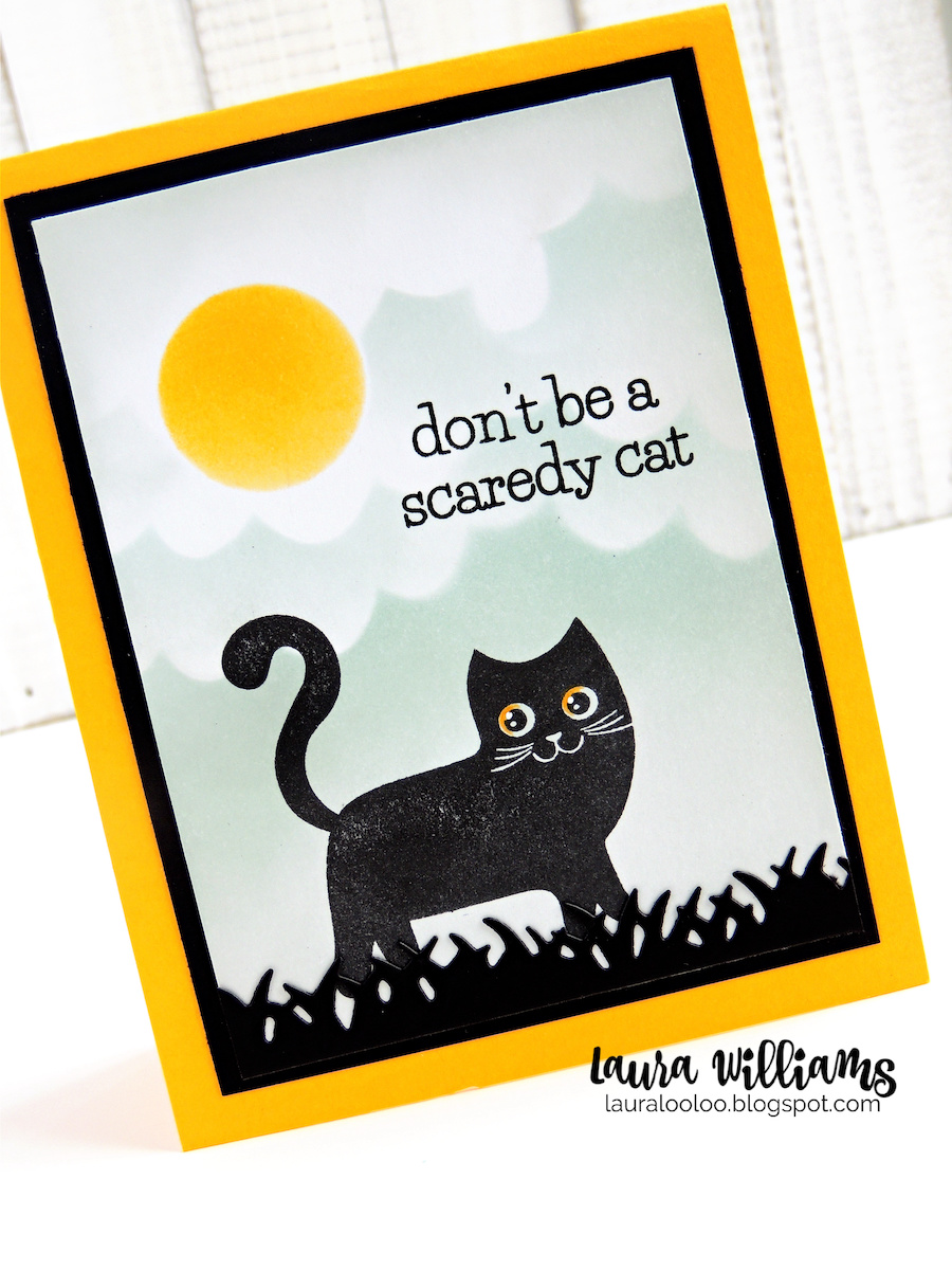This image is a handmade Halloween card with a stamped cat in black ink. The cat is standing in black grass under a cloudy moonlit sky, created with inking and handmade stencils. The sentiment says "Don't be a scaredy cat."