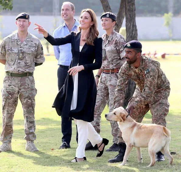 Kate Middleton wore a Kurta by Elan, one of Pakistan's leading design houses. Kate wore a crossover flat shoes by Russell and Bromley