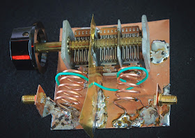 A 88 --108 MHz double-tuned filter with green coupling wire. 