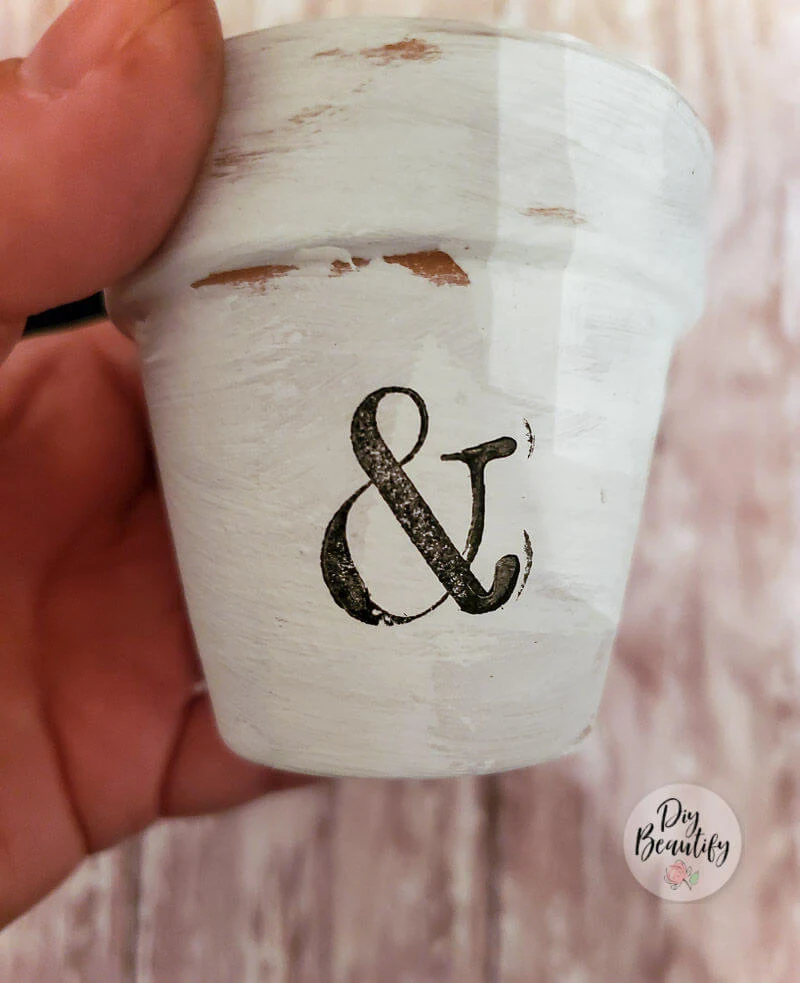 painted pot with inked graphic