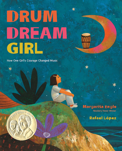 "Drum Dream Girl" illustrated cover which shows a young girl sitting and looking at a crescent moon with a drum in it.