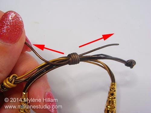 Tighten the sliding knot by pulling the two cord ends in opposite directions.