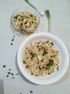 Serving Chicken fried rice recipe with  green scallions garnished