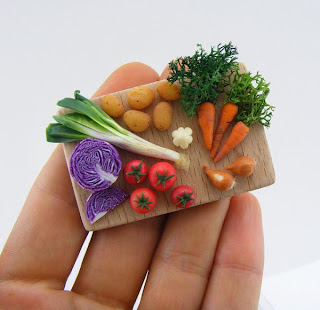 Polymer miniature vegetables on cutting board by Shay Aaron