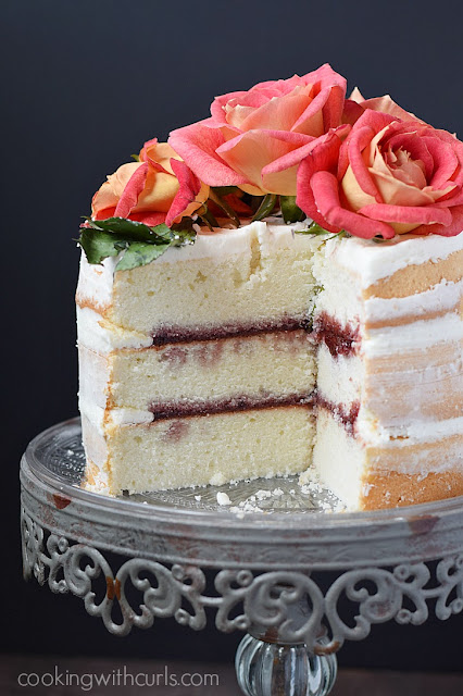 naked 3 layer cake with raspberry preserves