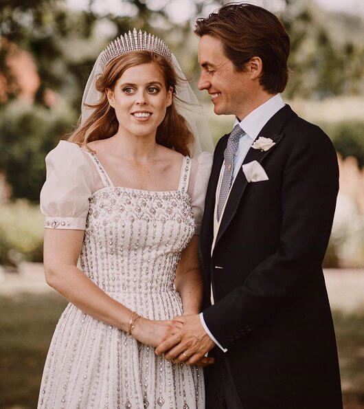 Princess Beatrice wore a vintage dress by Norman Hartnell and the Queen Mary diamond fringe tiara. Wedding of Princess Beatrice
