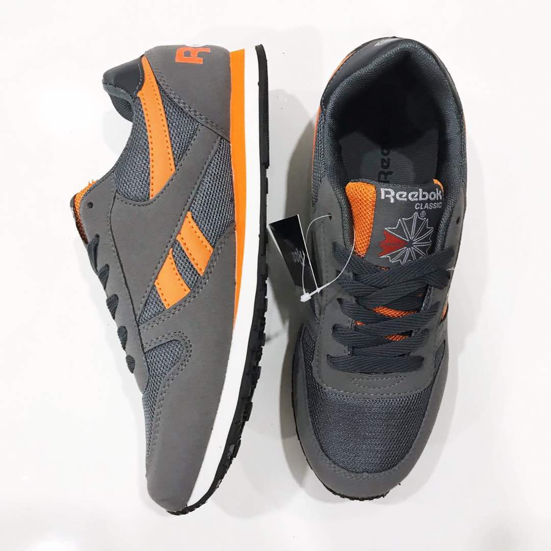 orange and blue reebok classics