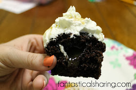Caramel Frappuccino Cupcakes | Moist chocolate cupcakes with a caramel center topped with whipped cream and caramel sauce