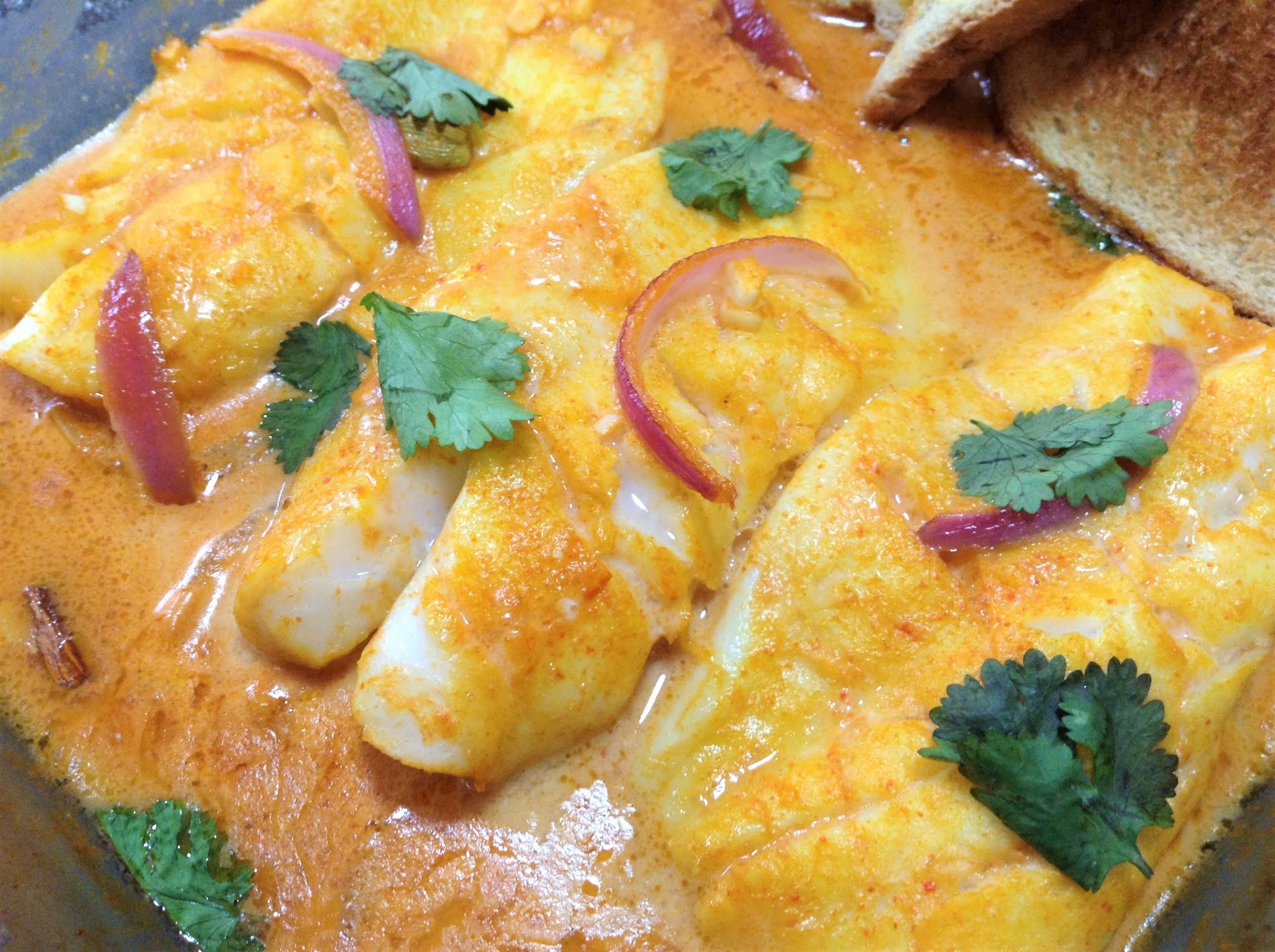 Orange Roughy Baked In A Creamy Coconut & Tomato Sauce