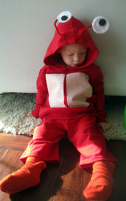 A little boy holding a teddy bear