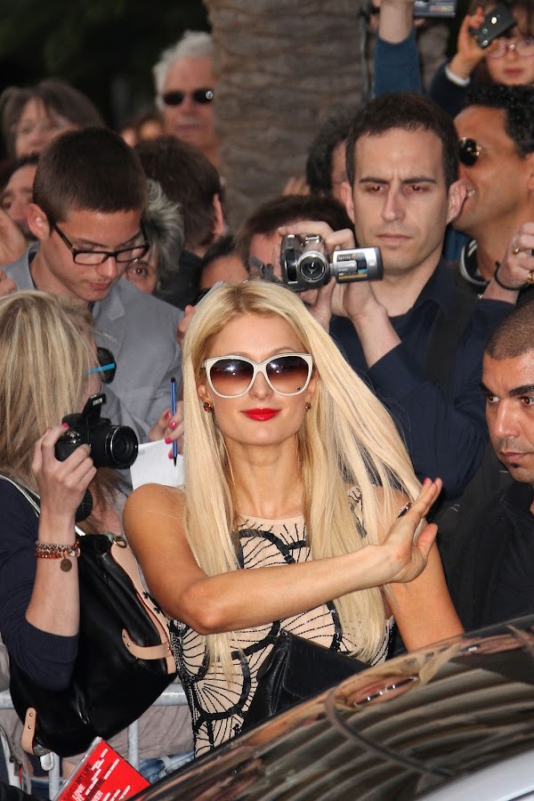 PARIS HILTON with white sunglasses arrives at Nikki Beach club in Cannes 2012