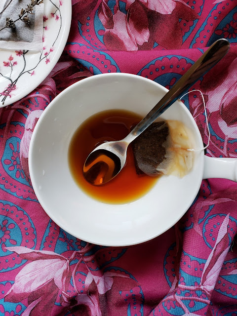 Earl Grey tea steeping with vanilla extract and cane sugar