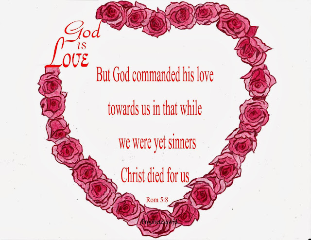 heart made of red roses with God is Love written on the side with scripture verse in the center