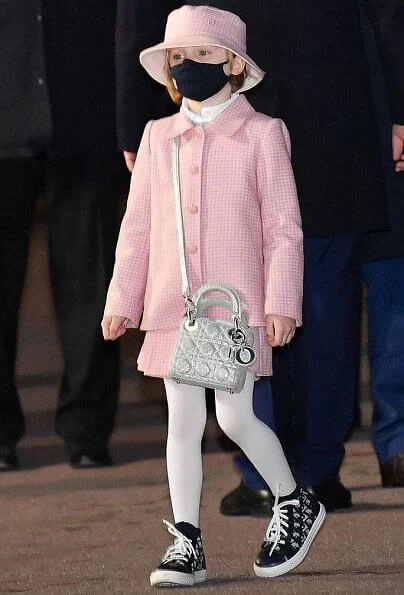 Princess Charlene wore a new leather-trimmed wool-blend tweed coat from Akris. Princess Gabriella wore a tweed jacket and skirt from Jacadi, Dior