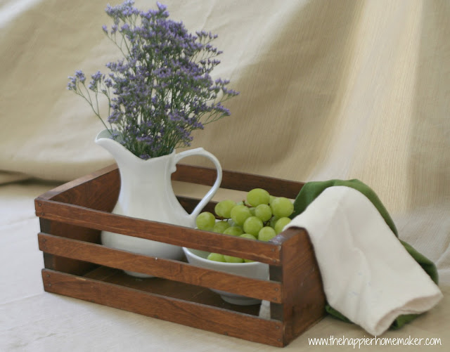 A room filled with furniture and vase of flowers on a table