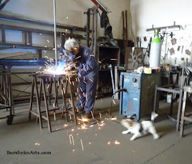 welding, sculpture armature, dog barking at fire, Tuscany, Italy