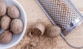 How do you crack and grate whole nutmeg with shell