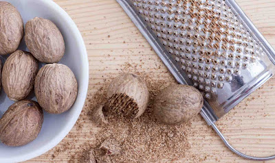 How do you crack and grate whole nutmeg with shell