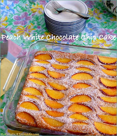 Peach White Chocolate Chip Cake starts with a boxed cake mix. Fresh peaches, cinnamon and white chocolate chips add fresh summer flavors. | Recipe developed by www.BakingInATornado.com | #recipe #cake