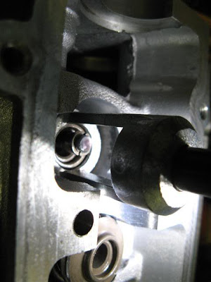 Install valve springs lock in head compressing
