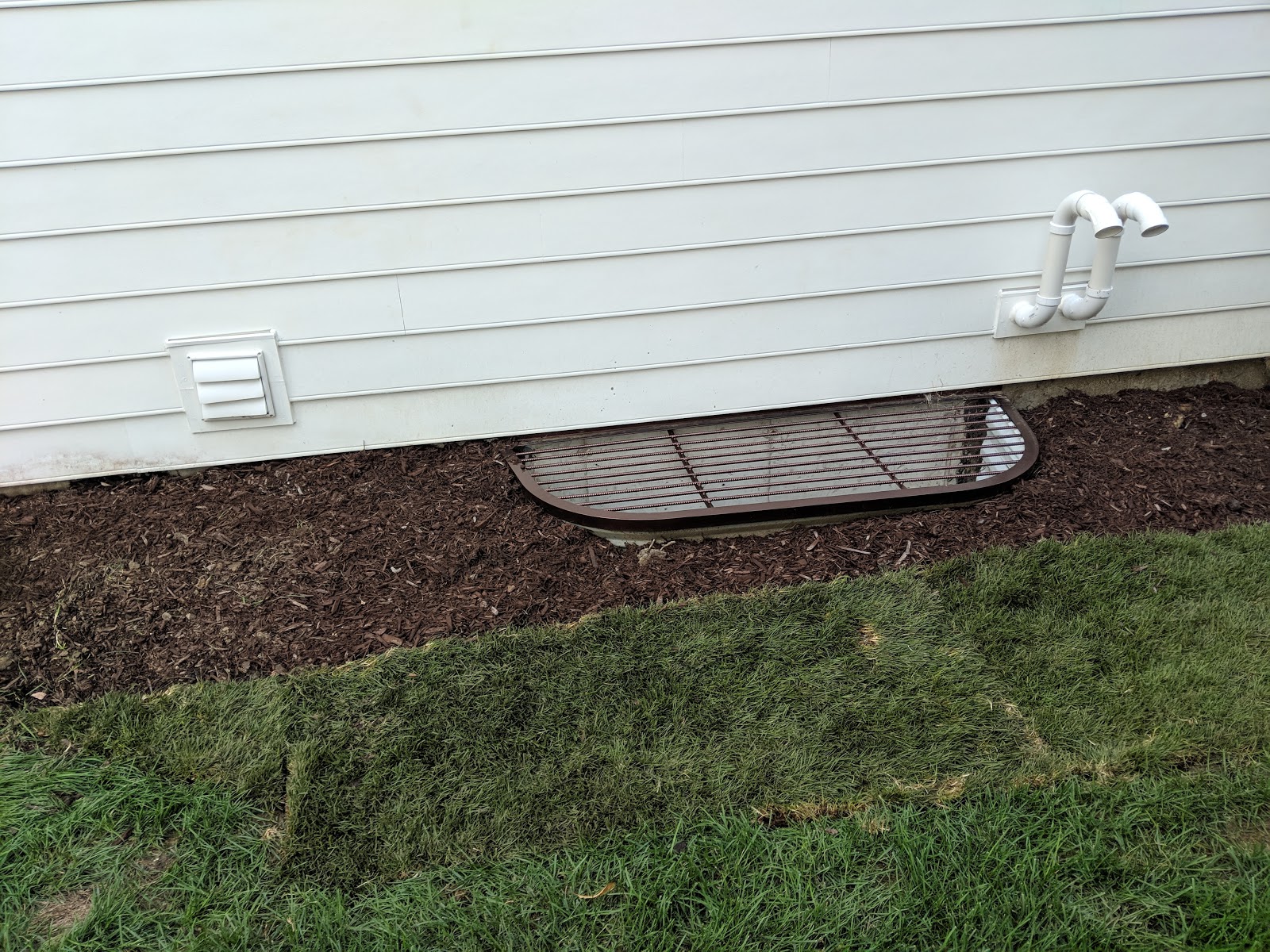 Before/After Southside Window Well Cleanup