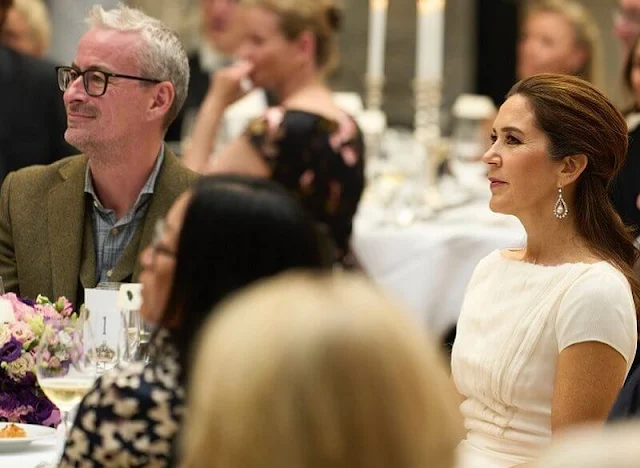 Crown Princess Mary wore a white dress by David Andersen, and Paris white leather pumps by Gianvito Rossi