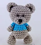 http://www.ravelry.com/patterns/library/sam-the-little-teddy-bear