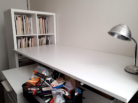 IKEA white bookshelf and desk.