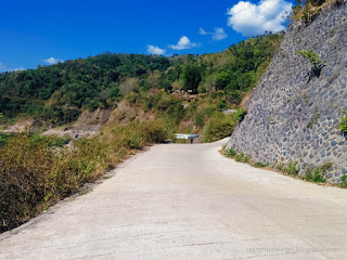 Concrete Road Between Cliffs And Ravines In The Hilly Area On A Sunny Day Titab Ularan North Bali Indonesia