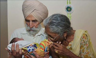 oldest mother to give birth at 72 years old and her husband with their child