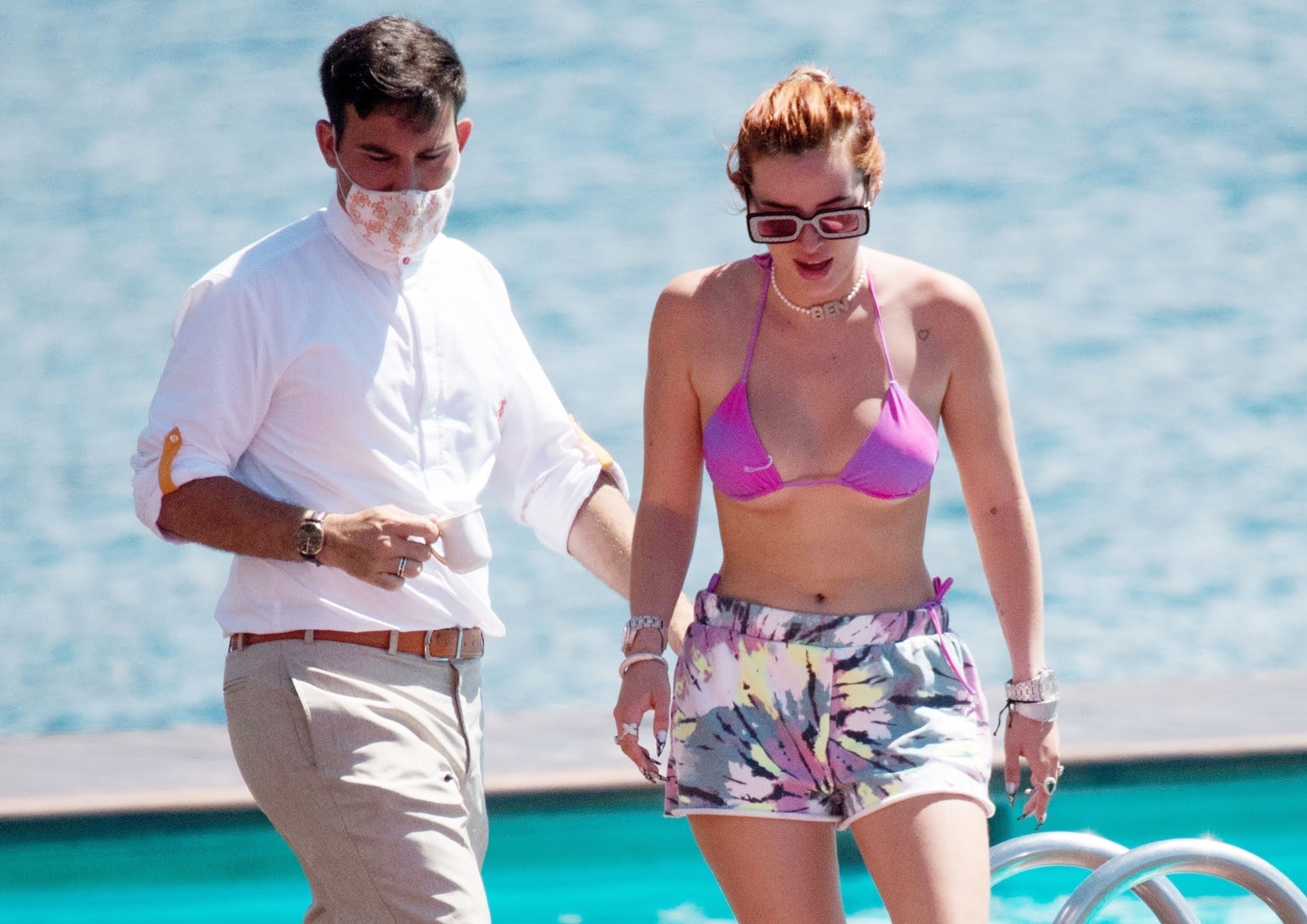 Bella Thorne shows off her toned figure in a tiny purple bikini in Italy