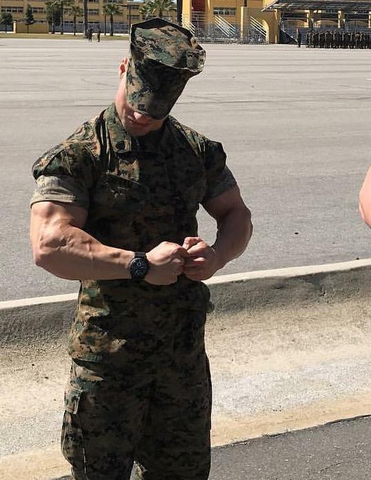 handsome-male-soldier-in-military-uniform-flexing-huge-veiny-muscle-biceps