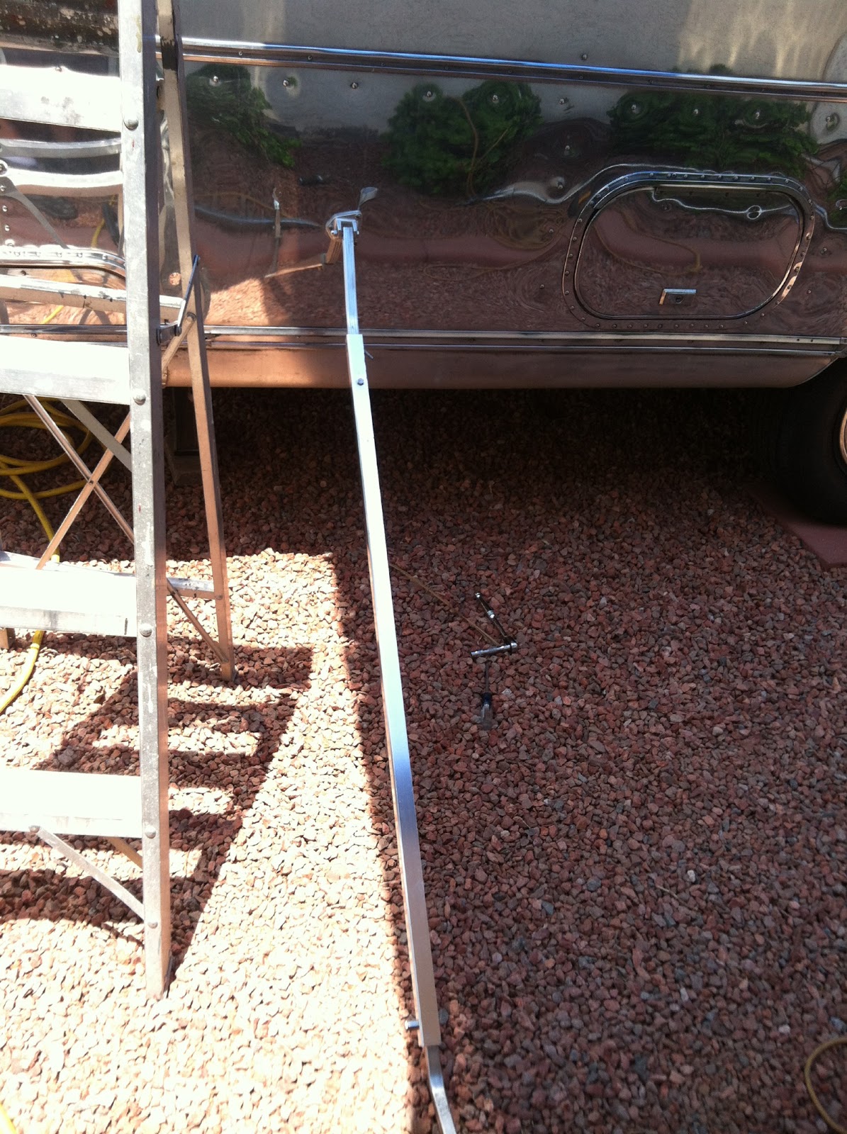 Airstream Renovation Airstream awning Installation with hood vent modification