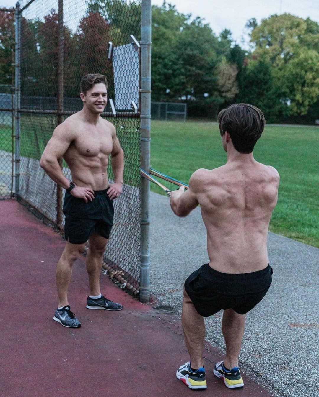 two-fit-shirtless-hunky-men-outdoor-workout