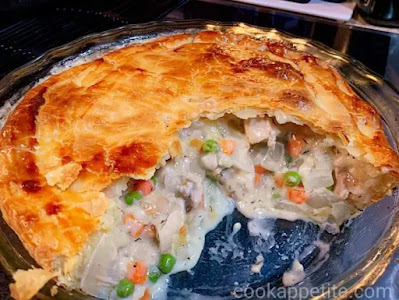 Chicken pie recipe loaded with flavor. This chicken pie is quick, it's made with fillings that are ready fast and with a store-bought puff pastry. Buying a store-bought puff pastry means that the only thing you'll have to do is make the filling. The filling is made with a bunch of vegetables and chicken or meat.