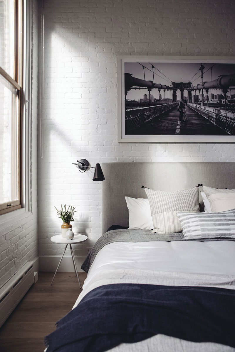 Stylish loft in New York with warm natural accents by Becca Interiors