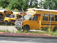 yellow school bus with hood open