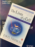 The Lives of a Cell, by Lewis Thomas, superimposed on Intermediate Physics for Medicine and Biology.