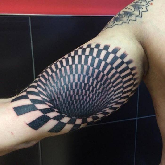 Optical illusion tattoo.