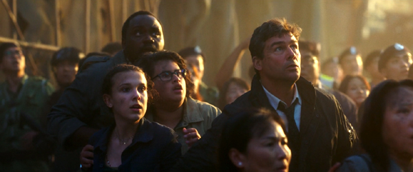 Bernie Hayes (Brian Tyree Henry), Madison Russell (Millie Bobby Brown), Josh Valentine (Julian Dennison) and Mark Russell (Kyle Chandler) are shaken by Godzilla's roar in GODZILLA VS. KONG.