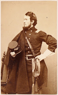 A photograph of a man in uniform.