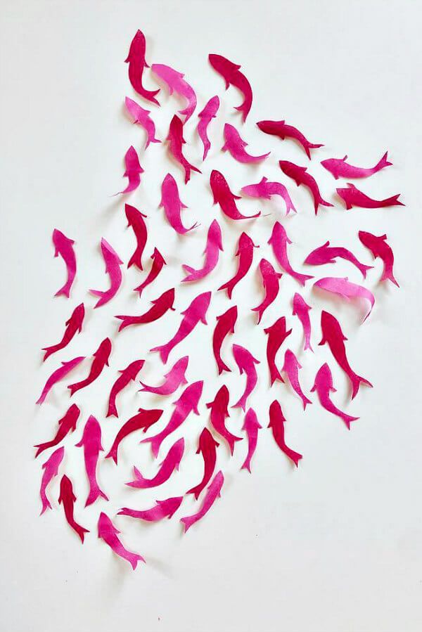 pink and red tissue paper hand cut school of dimensional fish