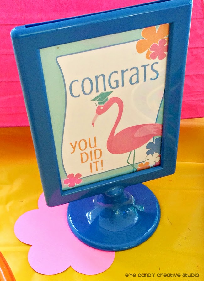 congrats grad sign, flamingo, grad cap, blue IKEA frame, luau grad party