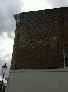 Ghost sign on St. Charles Square, London W10